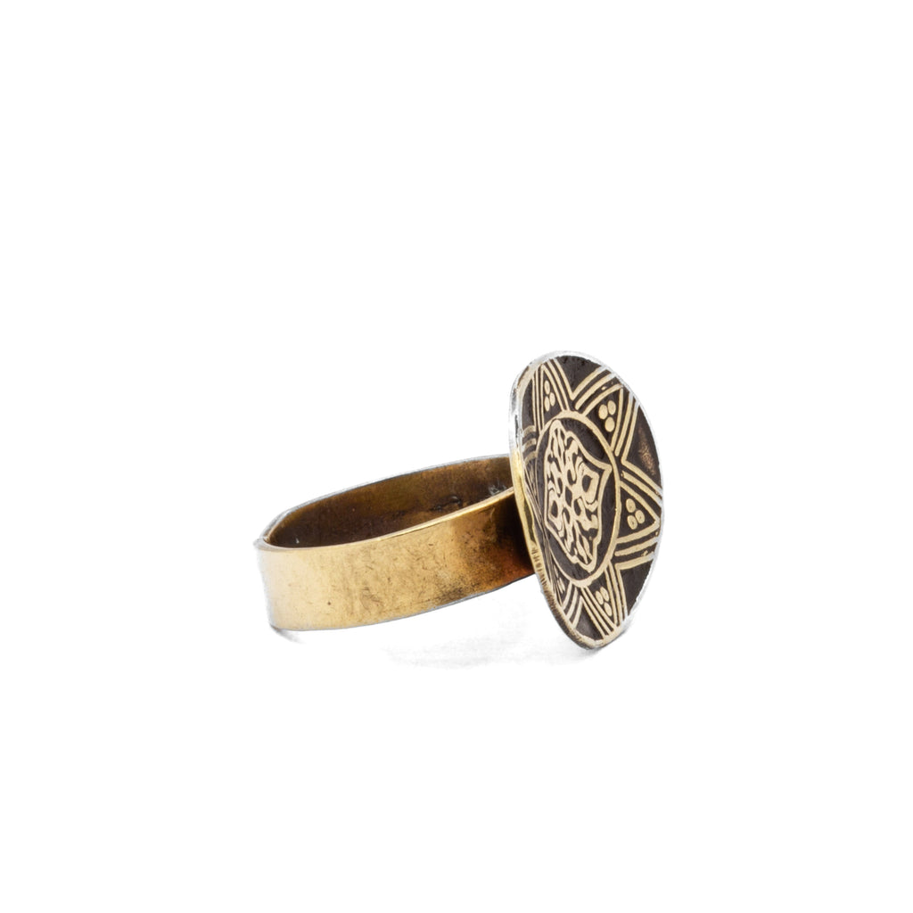 Side profile of Fadela brass ring, highlighting refined curve and band sculptural form