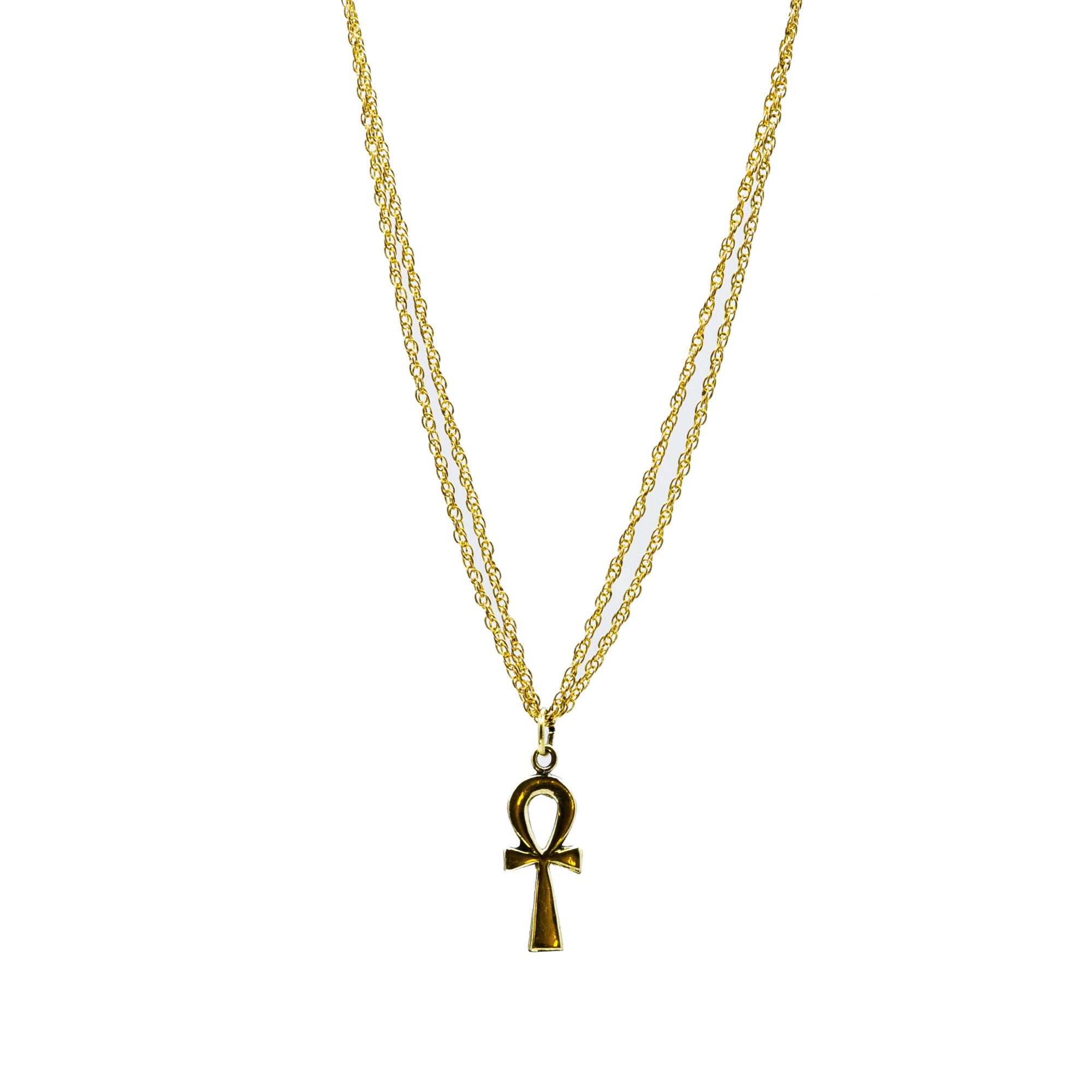 Close-up of Feryal hand-forged raw brass chain links, showing natural texture and antique finish