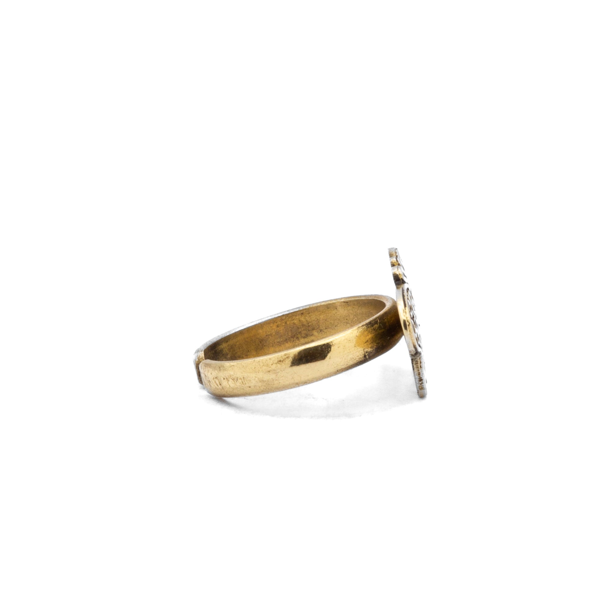 Left side angle of Frasha brass butterfly ring, showcasing symmetrical wing design
