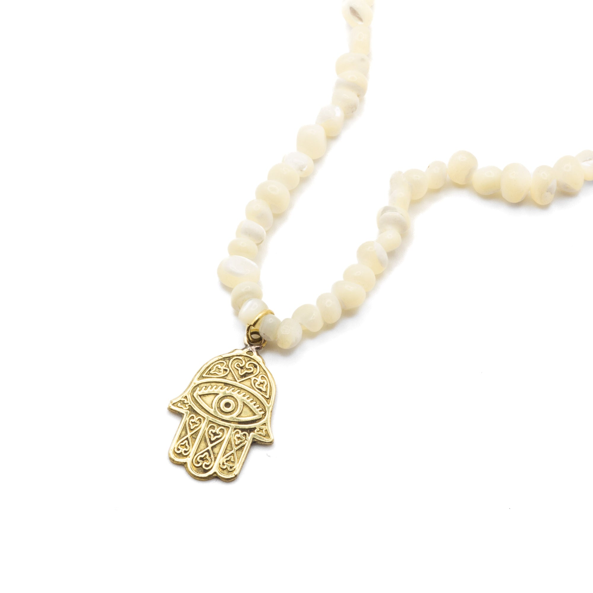 Nabila handmade raw Egyptian brass necklace, front view showing ancient-inspired textured pendant design
