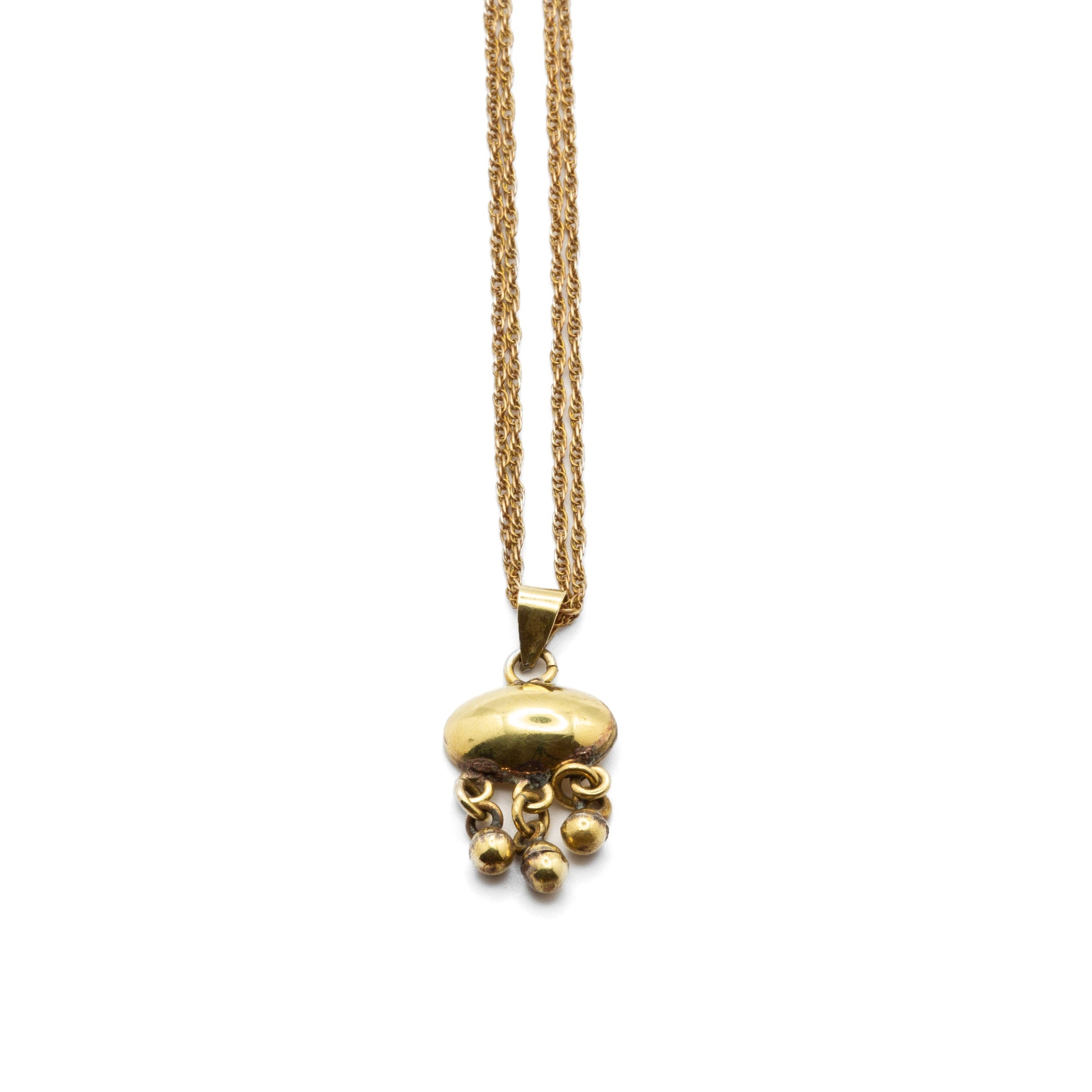 Close-up of Nadia hand-finished brass link detail, showing natural texture and evolving antique patina